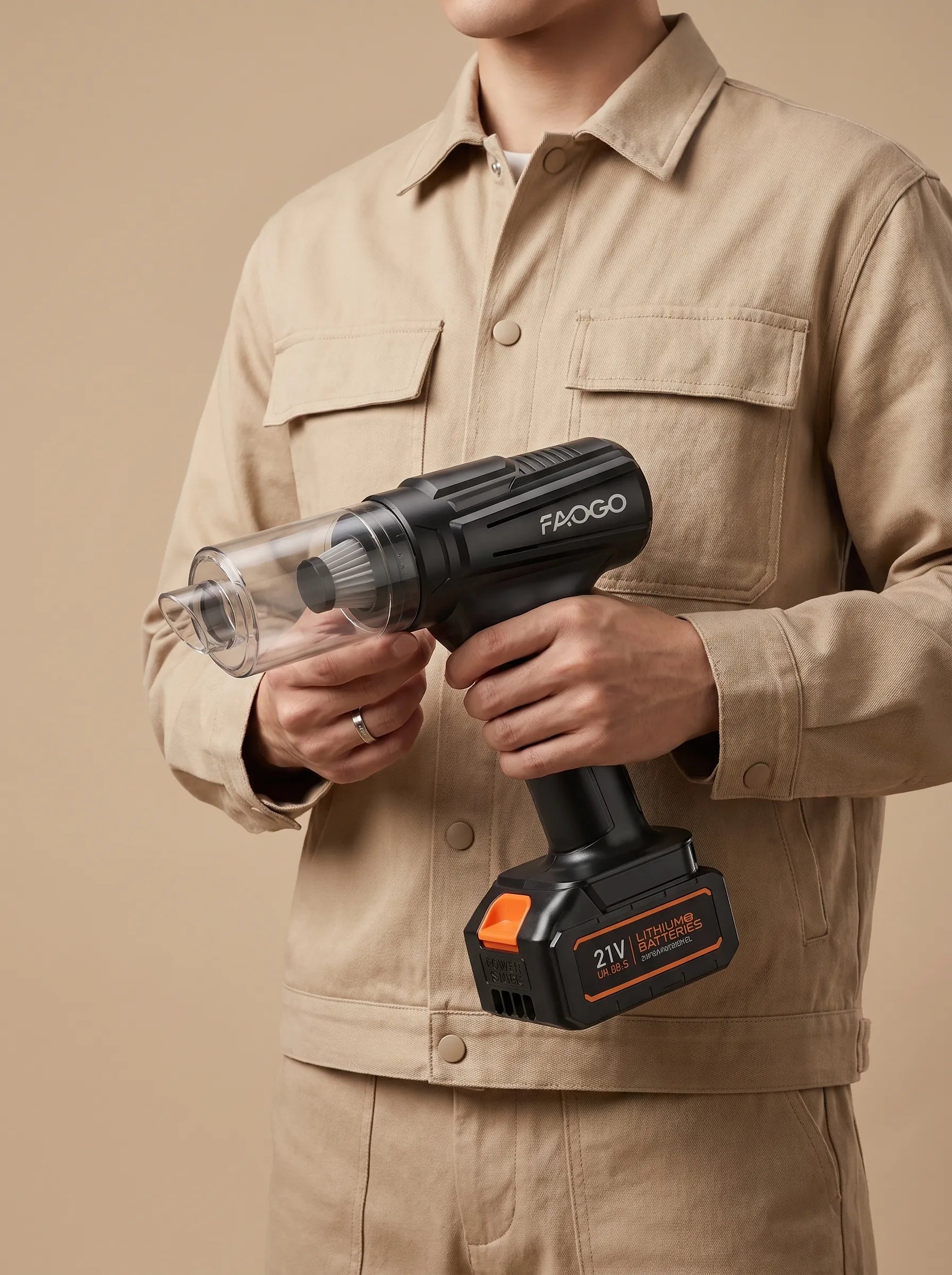 Man holding FAOGO 21V cordless workshop vacuum. Portable battery-powered dust collector for craftsmen and DIY detailing.