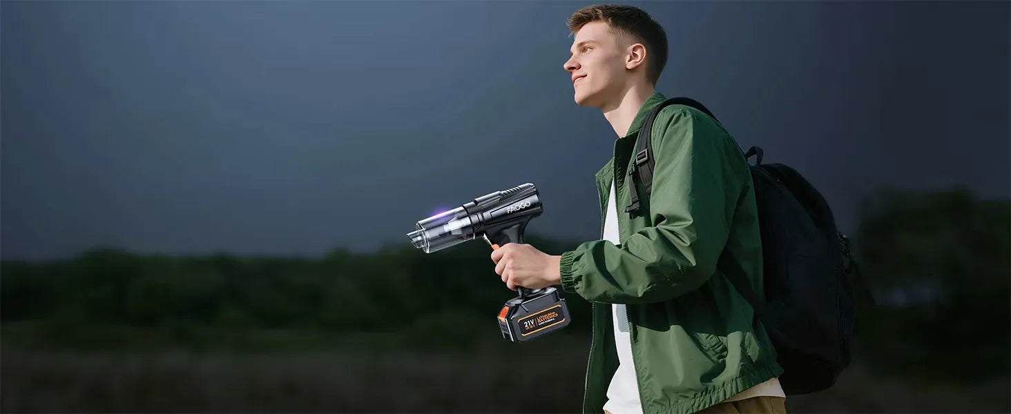 Man carrying FAOGO portable cordless vacuum during outdoor trekking. Lightweight 21V battery duster for camping gear.